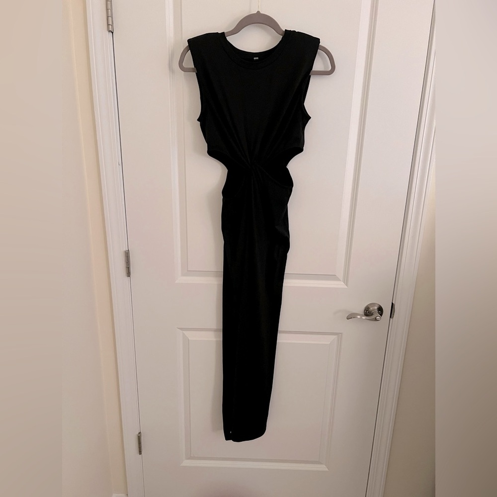 Maxi, jersey knit dress with cutouts on side.